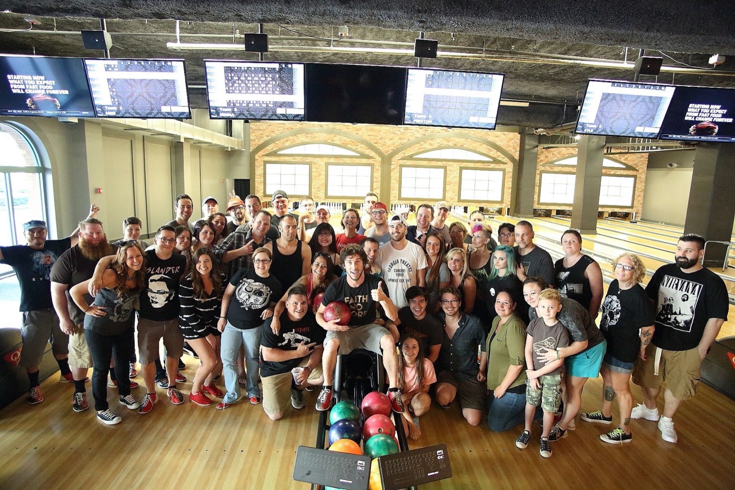 Large group photo of event guests and staff